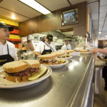 A view of Langer's Deli's counter where sandwiches are placed for delivery to customers