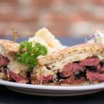 A Factor's Famous Deli pastrami sandwich featuring RC product